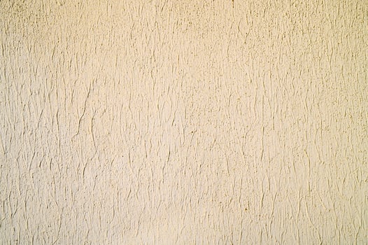 Plaster texture with glossy white acrylic exterior painting. photo