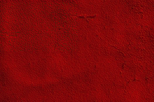 Red matte suede background macro photo. Suede texture photo
