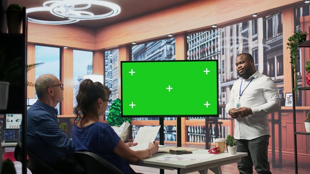 Mature couple attend a consultation with a financial broker about retirement plans, isolated mockup screen on laptop. Specialist and clients covering savings growth and financial security. Camera B. photo