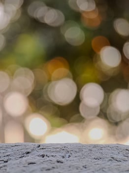 blurred background with soft, circular bokeh lights and a textured foreground. Perfect for serene designs. photo
