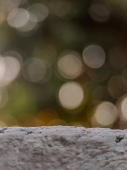 blurred background with soft, circular bokeh lights and a textured foreground. Perfect for serene designs. photo