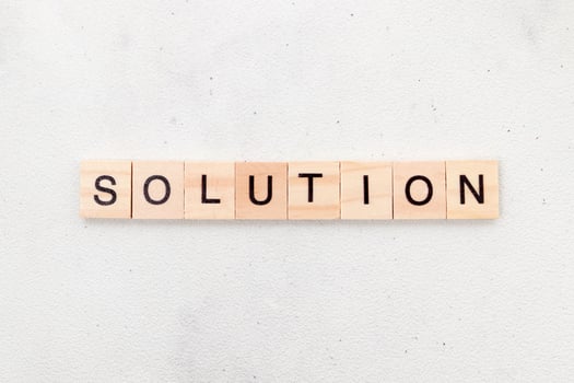 Top view of Solution word on wooden cube letter block on white background. Business concept photo