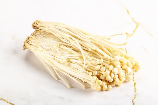 Tasty raw enoki mushroom heap photo