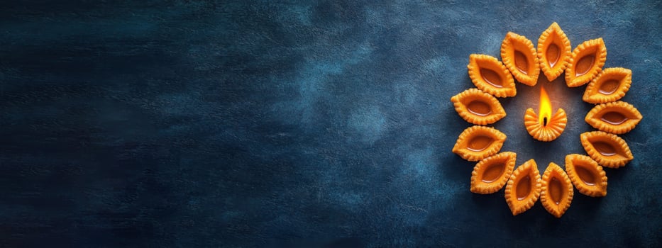 Diwali Diyas on Blue Background photo