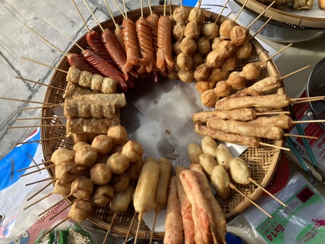 A big plate of varieties of fries in Thailand, Street food, sausage, meatball photo