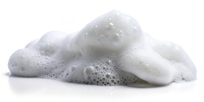 Soap foam on the white background. photo