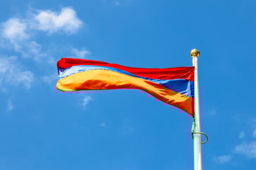 Armenian state flag and blue sky in background photo