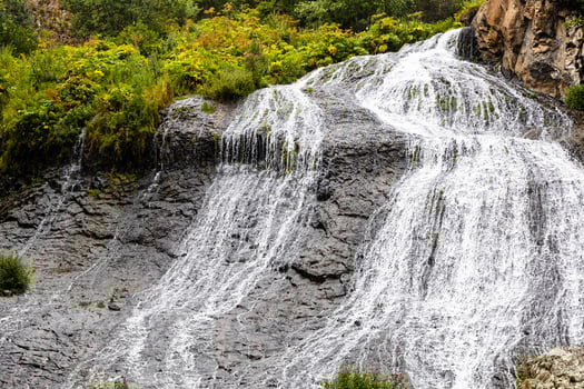 view of Jermuk Waterfall on rainy summer day photo