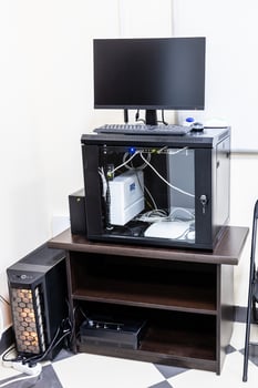 stand with server, router, computer monitor photo