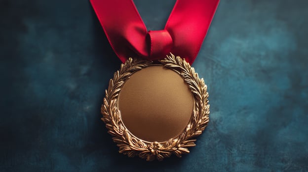 Elegant golden mirror with a red ribbon against a teal background for holiday decoration photo