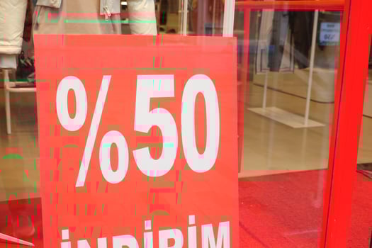 Large Sale text letters on red background on clothing store . photo