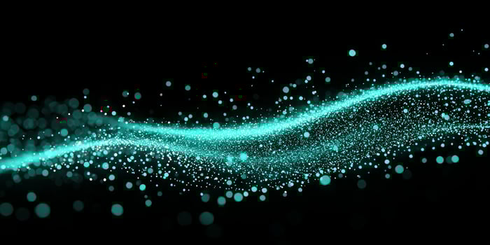 Turquoise particles cluster and flow in a mesmerizing wave, illuminating the darkness with a radiant glow. This captivating digital art evokes a sense of movement and tranquility. photo