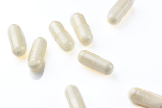 useful capsules with medicine painted in studio filming 4 photo