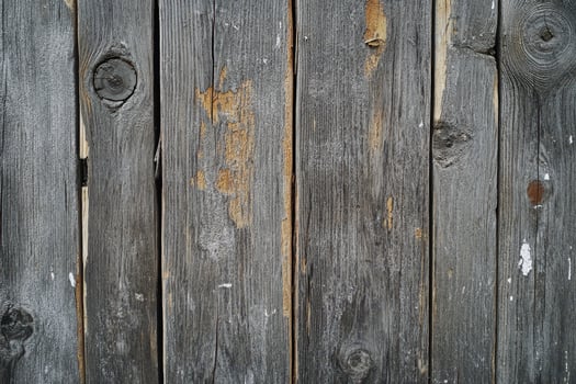 Weathered Wooden Planks with Knots and Flaking Paint photo