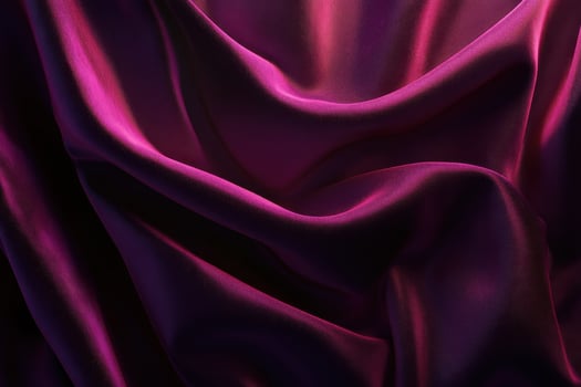 Close-up of Draped Deep Purple Fabric with a Smooth, Shiny Texture photo