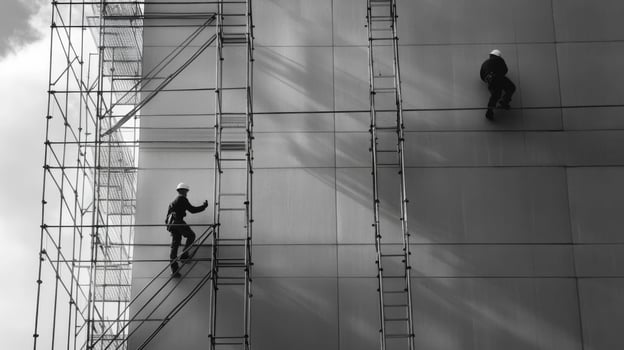 Construction Workers on Scaffolding on a Building photo