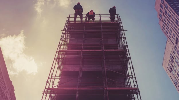 Construction Workers on Scaffolding Looking Up at the Sky photo
