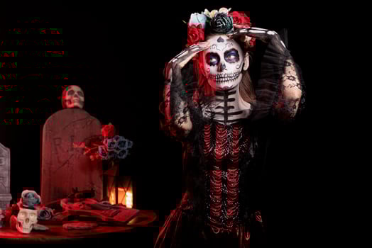 Woman with traditional attire at Day of the Dead event to remember the deceased, celebrating their memory. Lady wearing elegant silk dress for Mexican holiday of remembrance for those who have passed photo