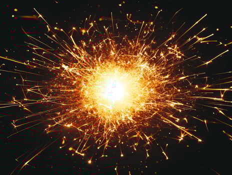 dynamic burst of orange particles erupts from the center, scattering outward in a spectacular display of radiant energy, illuminating the surrounding darkness. photo