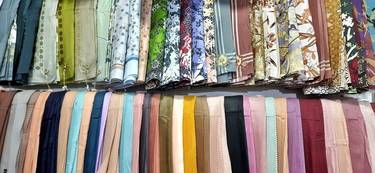 Various style colours muslim wear hijab head scarf sold in market. Islam religious concept background photo