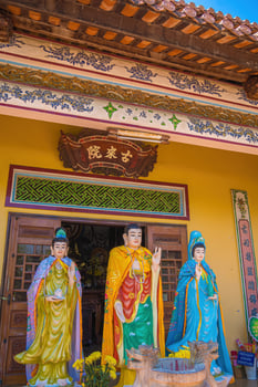 Buddhist Temple in Vietnam - Co Thach Monastery. Beauty architecture leads to Lord Buddha statue, which attracts tourists to visit spiritually on weekends photo