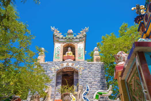 Buddhist Temple in Vietnam - Co Thach Monastery. Beauty architecture leads to Lord Buddha statue, which attracts tourists to visit spiritually on weekends photo