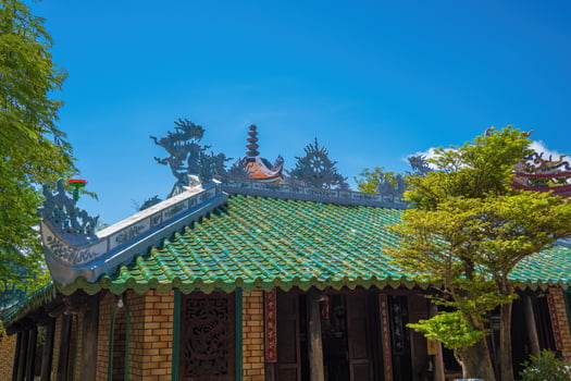 Buddhist Temple in Vietnam - Co Thach Monastery. Beauty architecture leads to Lord Buddha statue, which attracts tourists to visit spiritually on weekends photo