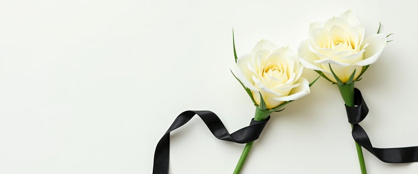 White Roses with Black Ribbon on White Background photo