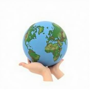 hand holding a globe. isolated on white background. photo