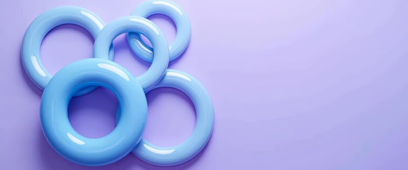 Abstract Background with Interlocking Blue Rings on Purple Background photo