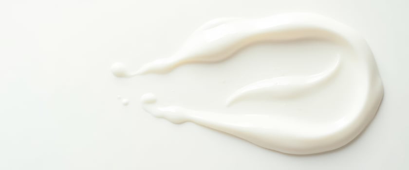 White cream swirl on white background photo