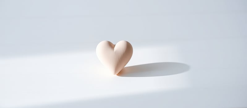 Simple Heart with Shadow on White Background photo
