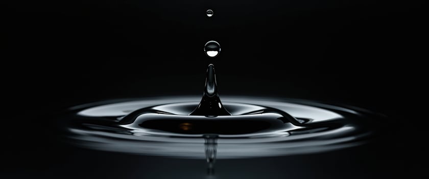 Water Droplet Splashing into Liquid photo
