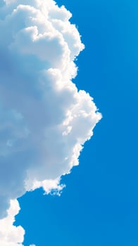 White fluffy clouds against a blue sky photo
