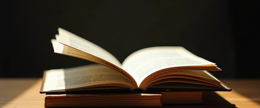 Open Book on a Wooden Table photo