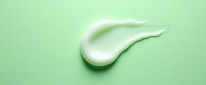 White Cream Swirl on Green Background photo