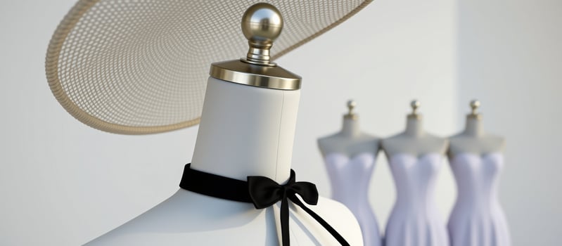 Fashion Mannequin with Straw Hat and Black Bow photo