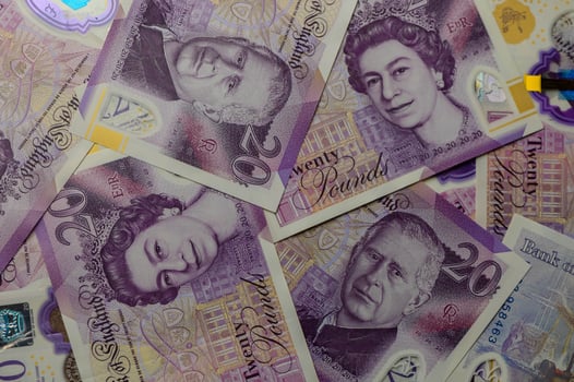20 pound sterling bank notes closeup view business background 3 photo