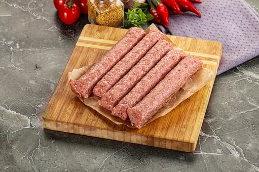 Raw beef kebab sausage for grill photo