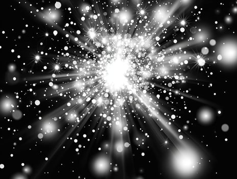 A striking display of silver particles explodes outward from a central point against a stark black background, evoking energy, movement, and high contrast. photo