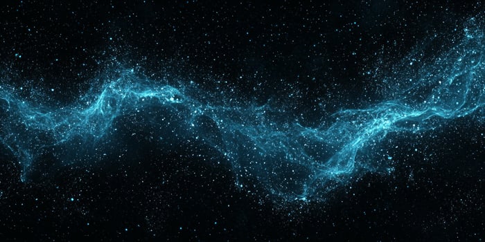 A mesmerizing display of blue particles gracefully coalesce to form a flowing wave amidst a dark backdrop, radiating soft light and delivering an otherworldly ambiance. photo