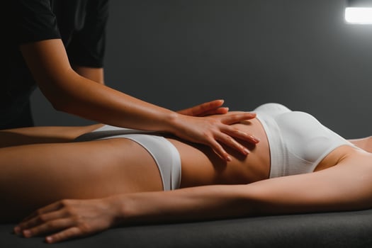 Masseur doing massage on woman body in the spa salon. Beauty treatment concept photo