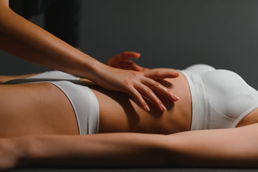 Masseur doing massage on woman body in the spa salon. Beauty treatment concept photo