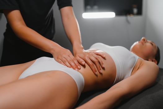 Masseur doing massage on woman body in the spa salon. Beauty treatment concept photo
