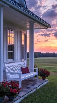 Inviting porch swing overlooking a picturesque farm at sunset photo