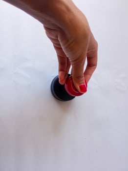 Asian female hand holding Flash stamp on a white background photo