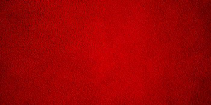 Red suede background. Suede texture macro photo. photo
