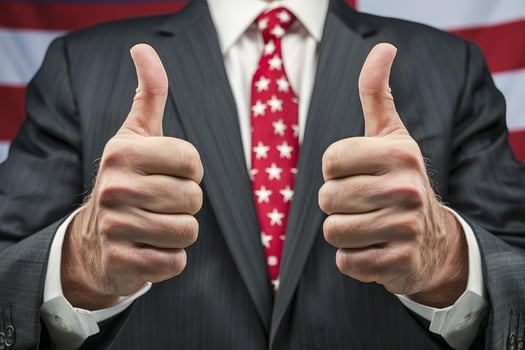 Politician gesturing thumbs up sign with american flag background photo
