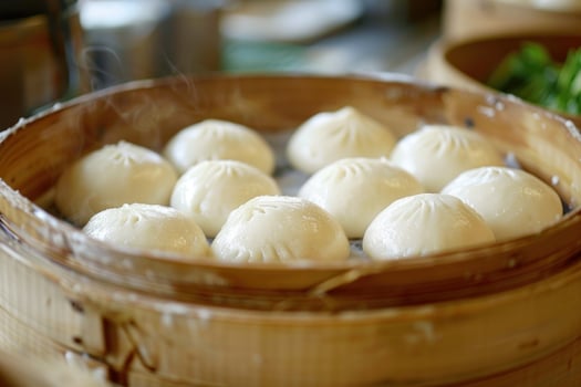 Steaming basket full of delicious dumplings in bamboo steamer photo