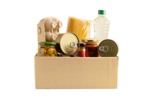 Foodstuff for donation isolated on white background with clipping path, storage and delivery. Various food, pasta, cooking oil and canned food. photo